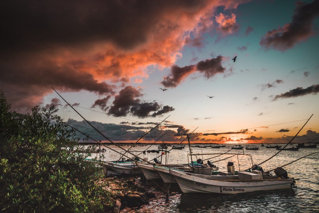 Boats on a sunset view at Rio Lagartos, Yucatan, Mexico