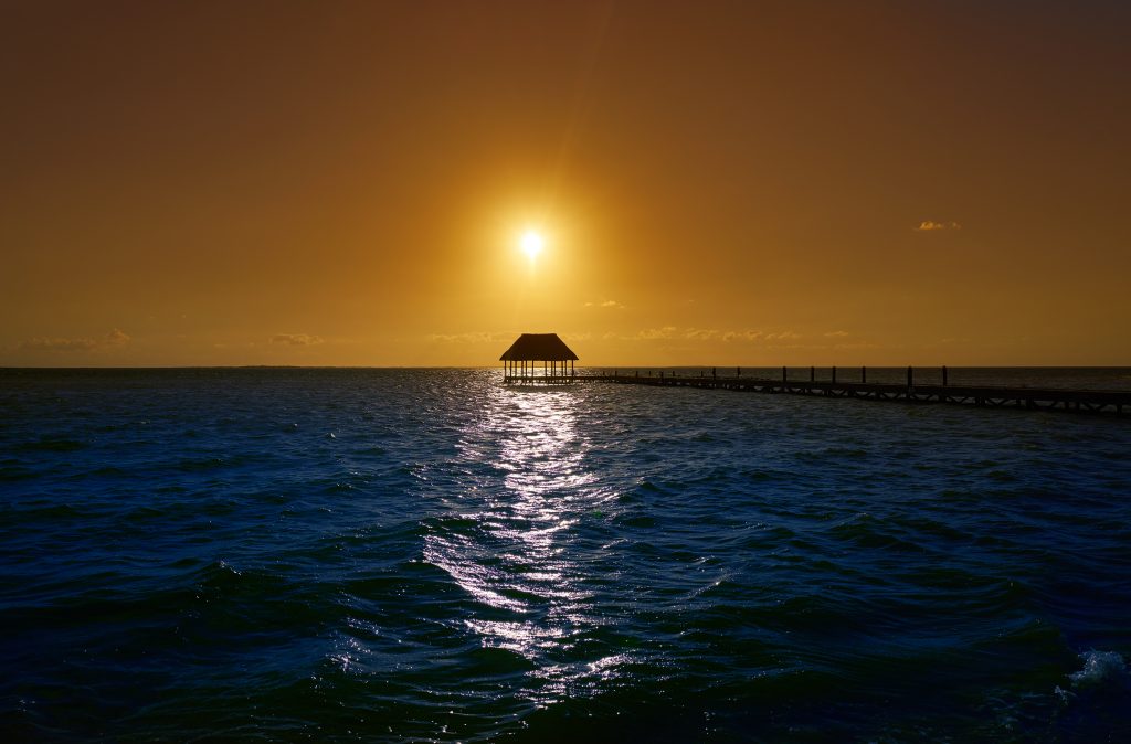 Holbox island sunset beach tropical hut pier in Mexico